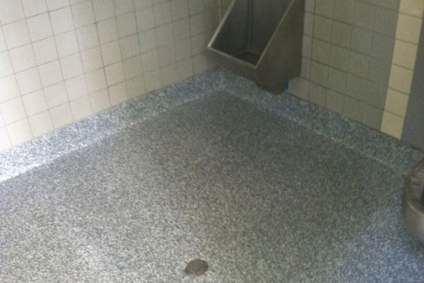 Flake epoxy coating up close at the floor edge