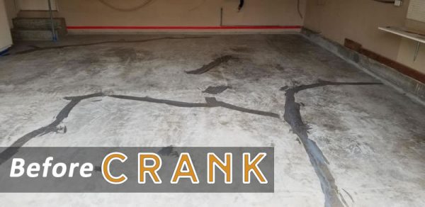 Garage floor before epoxy, with oil stains and cracks