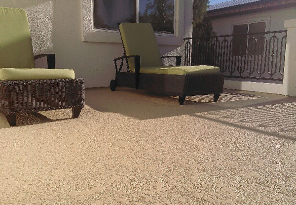 knockdown textured brown waterproof deck coatings on deck with brown chairs and green cushions