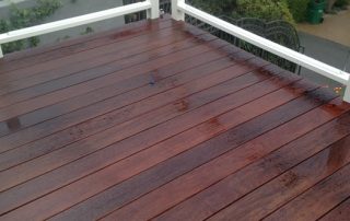 Orange County deck waterproofing company installs clear glass railings to improve the view