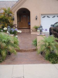 Orange County deck coatings in front of a house with flower beds