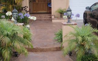 Orange County concrete resurfacing after with tile look walkway, porch,,and raised flower beds