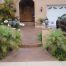 Orange County concrete resurfacing after with tile look walkway, porch,,and raised flower beds