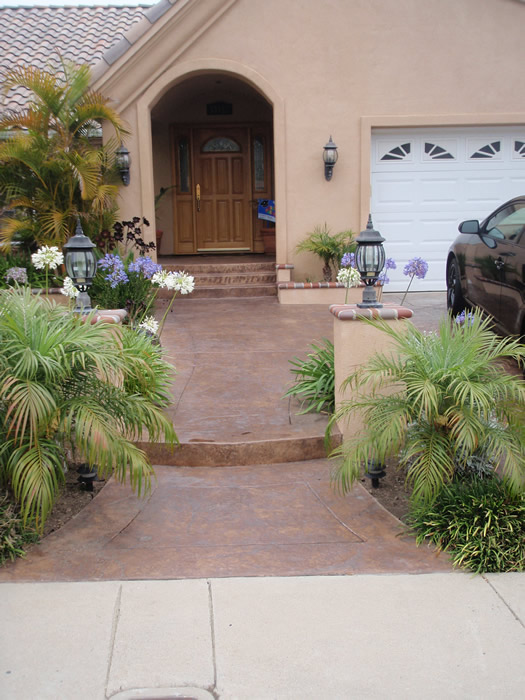 Orange County concrete resurfacing after with tile look walkway, porch,,and raised flower beds