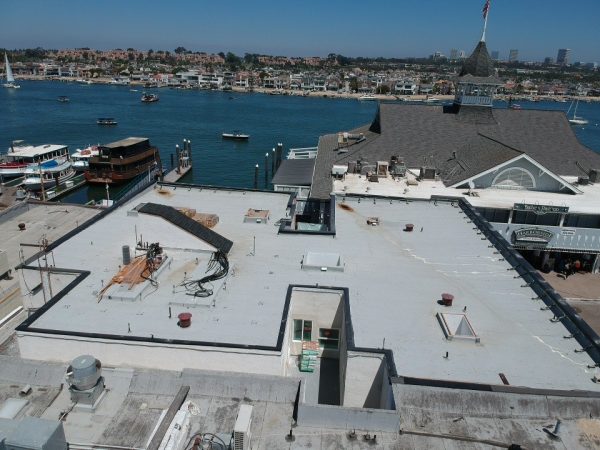 Flat roof coating with the marina in the background