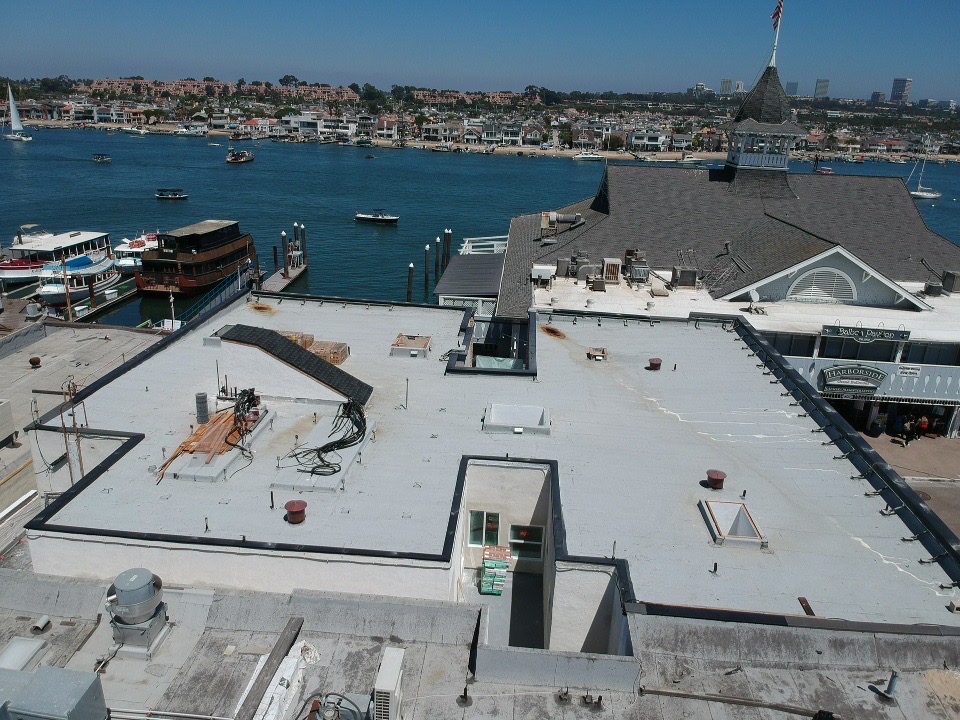 Flat Roof Coatings with marina in background