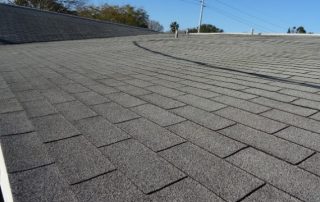 roof repair using grey composition roof in Orange County