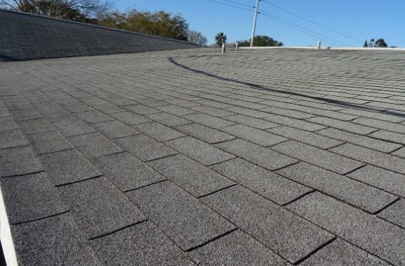 roof repair using grey composition roof in Orange County