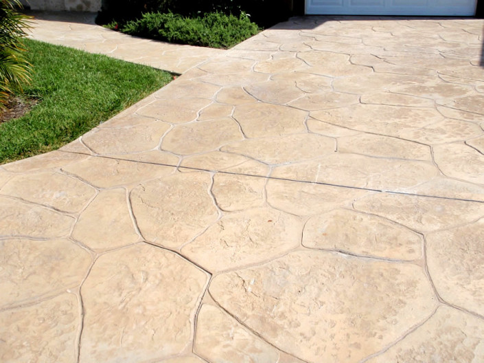 Concrete deck coatings look like flagstone in front of Orange County stucco home