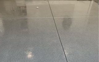 epoxy garage floor coating with grey flakes and high shine