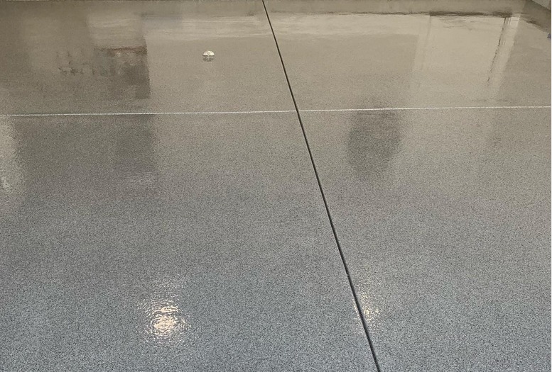 concrete resurfacing makes garage floor look like stone