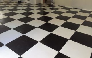 black and white checkerboard epoxy garage floor coatings look like a flag