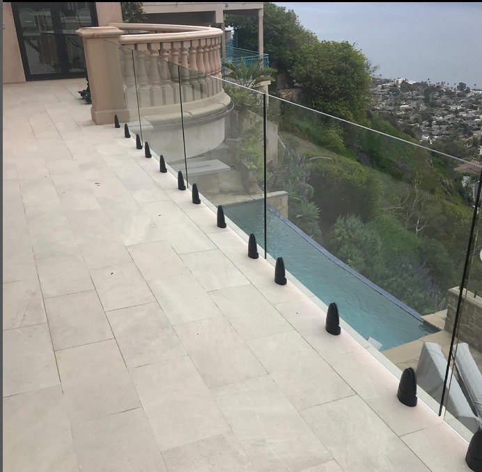 new tile deck construction showing clear deck railings in Laguna Beach