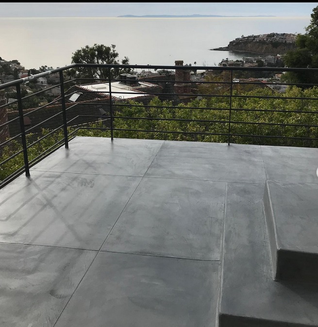 waterproof deck coatings used to simulate the look of concrete on deck overlooking the ocean