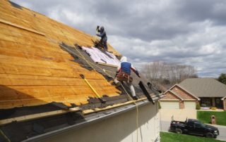 men completing roof repair in orange county