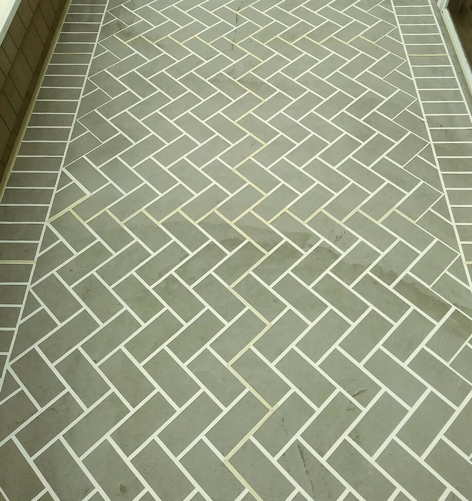 concrete resurfacing after with herringbone brick pattern