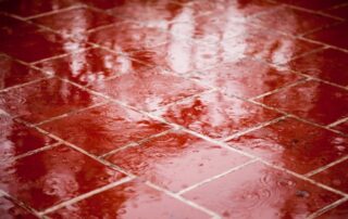 rain falling on red walkway
