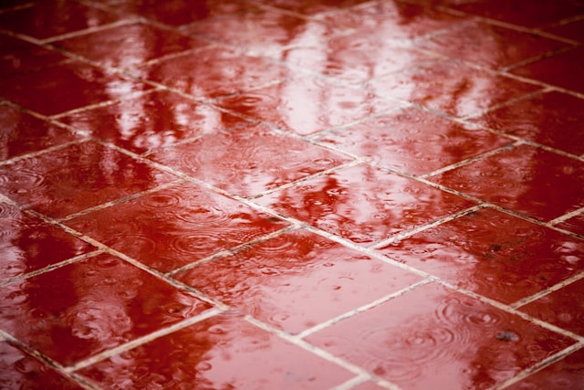 rain falling on red walkway